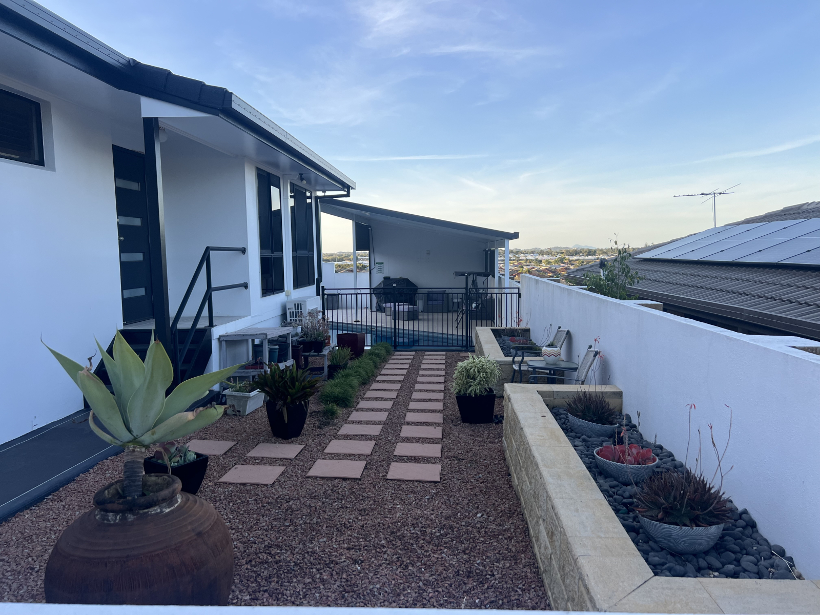 Courtyard with access to pool & BBQ area.