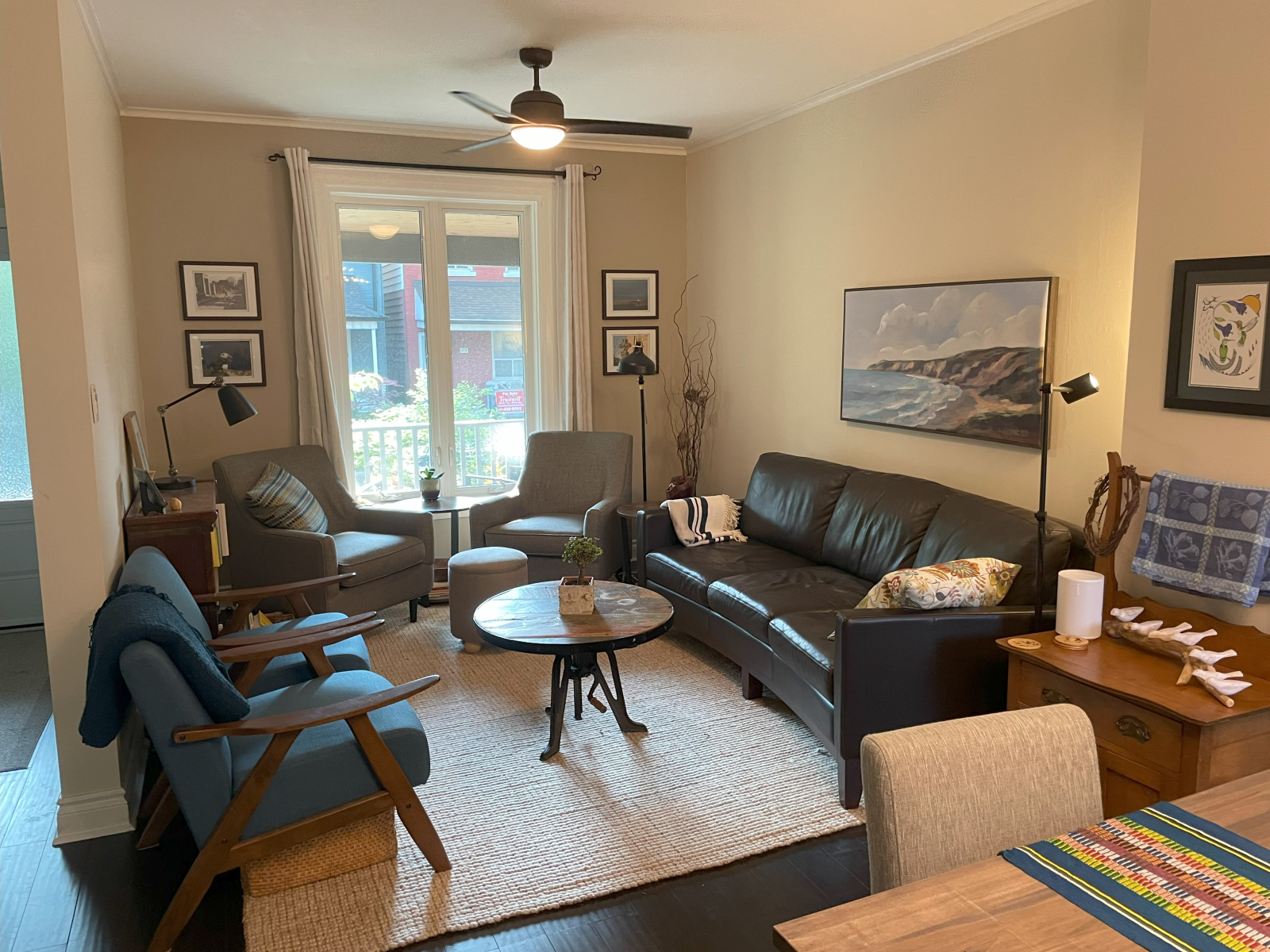 Comfortable living room connected to the dining area. Front entry to the left of pic.