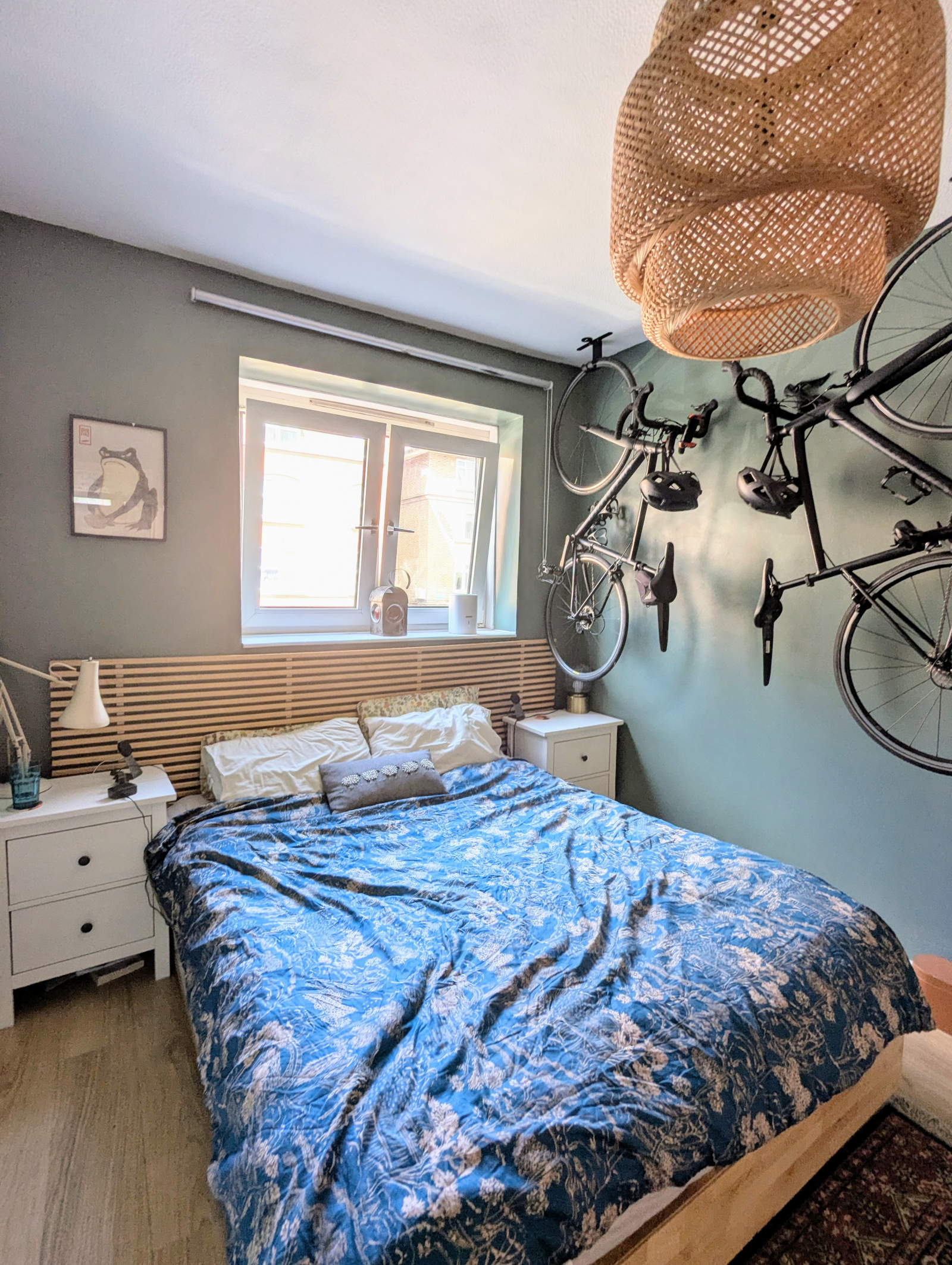 Our bedroom - a king size bed, 4 pillows and bedside tables on each side for some storage