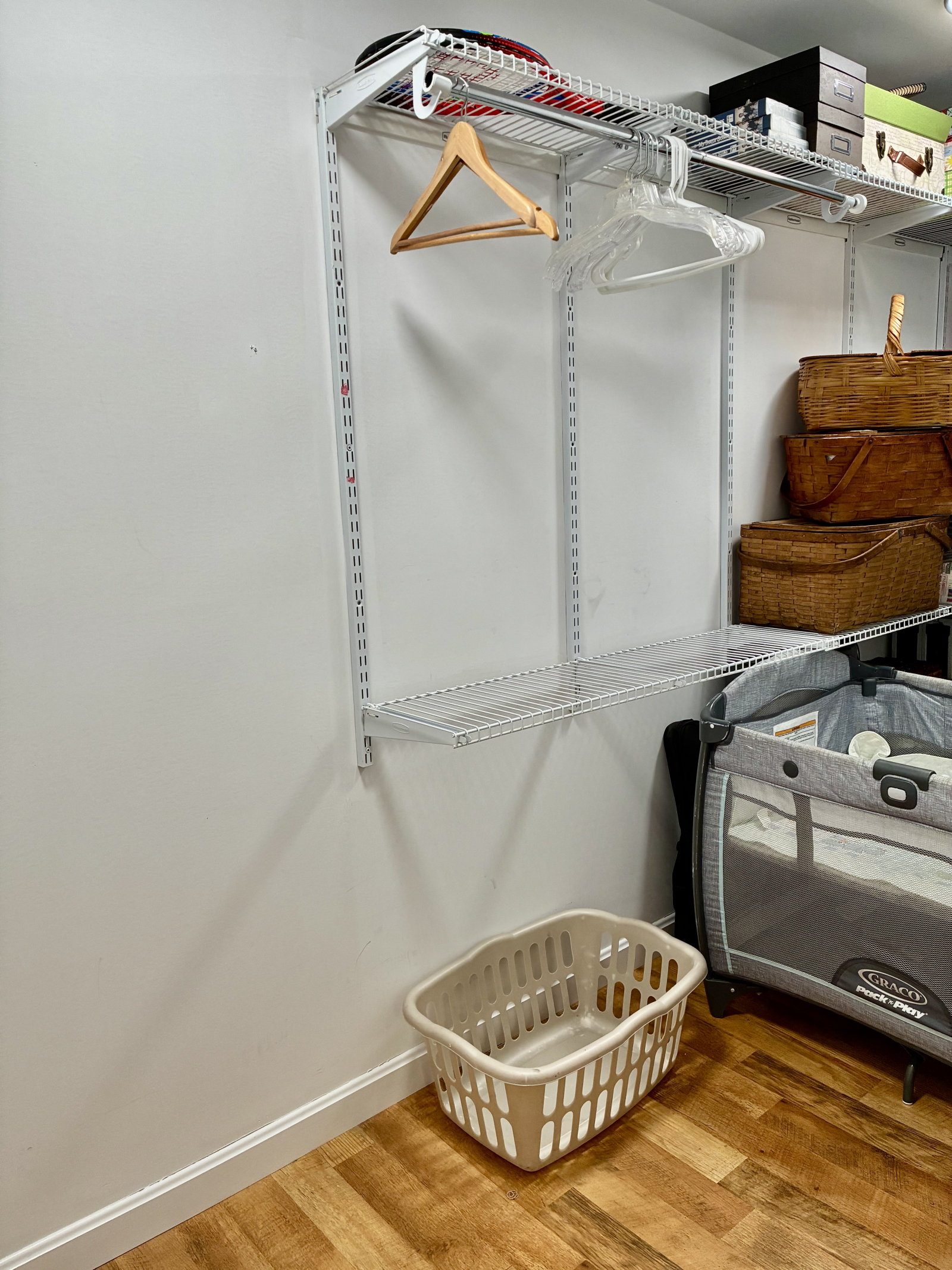 Guest room closet- hangers, basket.  It is also storage for things guests might need including a pac ...